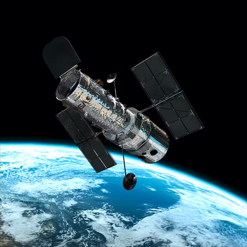 Picture of the Hubble telescope in space with the Earth in the background